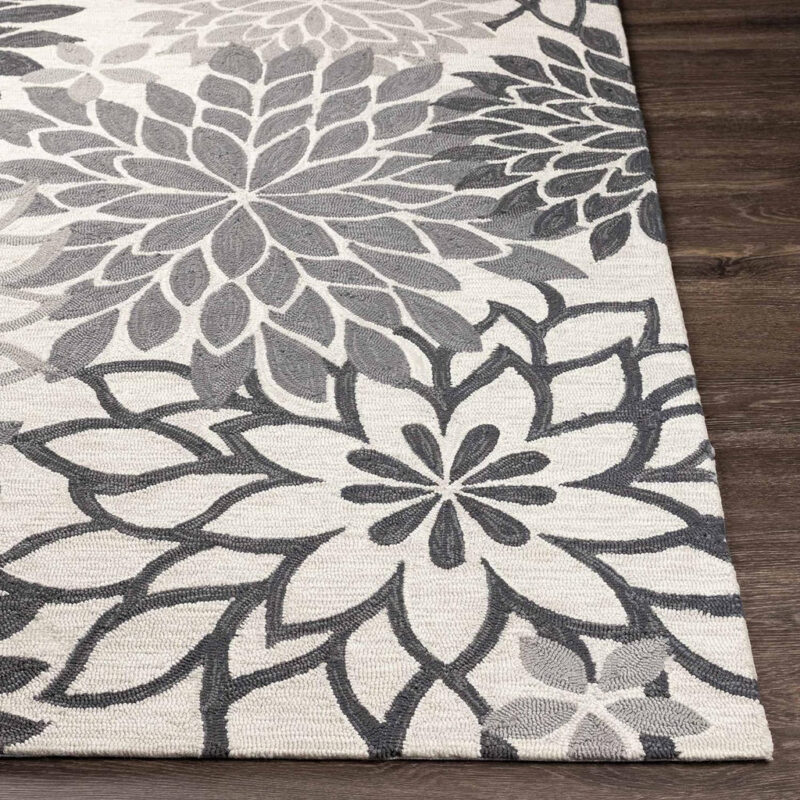 Contemporary hand tufted wool rug with monochrome floral detailing
