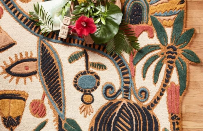 Tropical Botanical Wool Rug with Vibrant Jungle Florals Hand tufted tropical botanical wool rug with jungle flowers, sunbursts, and bold leaves in yellow, red, green, and blue