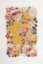 Yellow hand tufted floral rug with multicolored 3D blooming flowers and scalloped edges