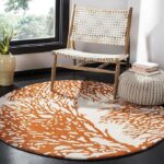 Round coral reef design rug in orange and cream – hand tufted wool carpet