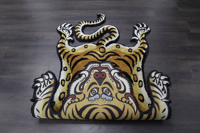Tiger Shaped Rug – Tibetan Style Hand Tufted Carpet Tiger shaped rug with Tibetan art style and bold black stripes on golden brown wool