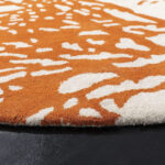 Round coral reef design rug in orange and cream – hand tufted wool carpet