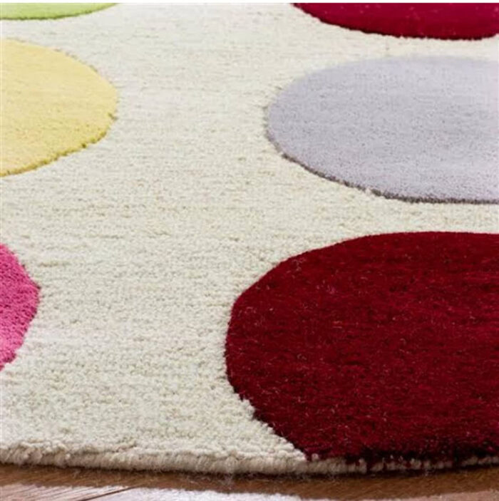 Colorful Polka Dot Kids Round Rug Soft colorful polka dot round rug close-up for kids room decor