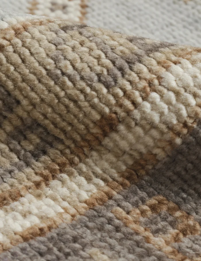 Wool area rug featuring neutral brown beige color palette