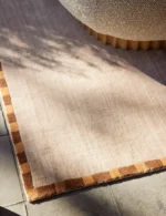 Minimalist neutral beige wool bedroom rug design