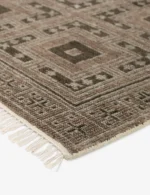 Traditional hand knotted rug with repeating motifs