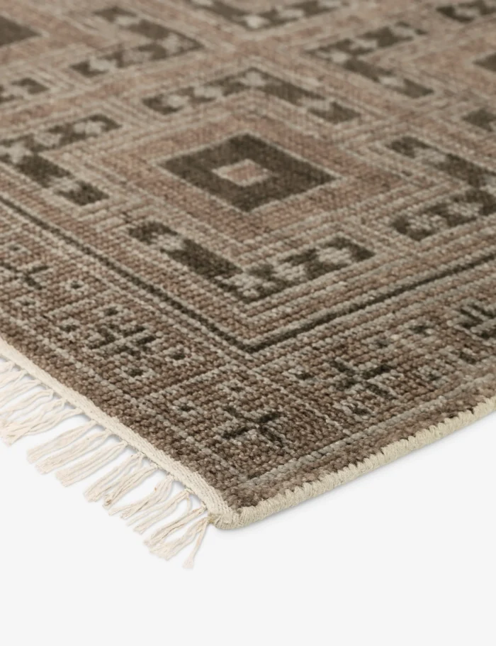 Traditional hand knotted rug with repeating motifs