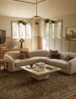 Artistic hand knotted wool area rug with ethnic motifs