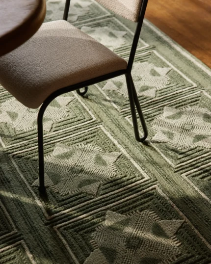 Wool hand knotted rug featuring classic geometric detailing