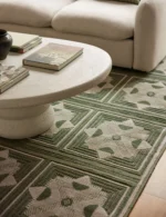 Artisan hand knotted green rug with symmetrical design layout