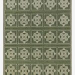 Green geometric hand knotted rug with repeating medallion pattern
