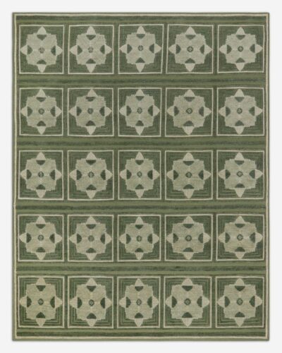 Green geometric hand knotted rug with repeating medallion pattern