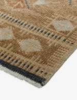Hand knotted wool rug in earthy tones