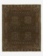 Hand knotted wool rug with tribal geometric pattern in earthy tones
