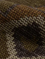 Ethnic hand knotted wool rug with symmetrical pattern detailing